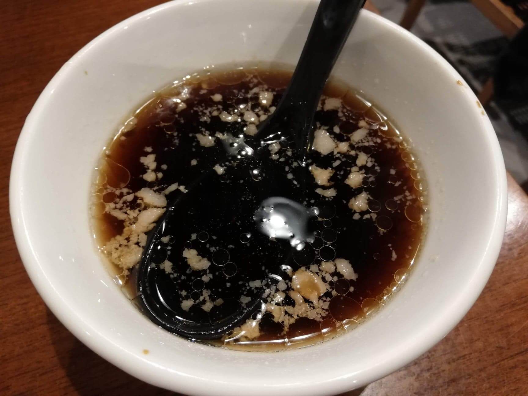 高田馬場『肉汁麺ススム』のスープの写真